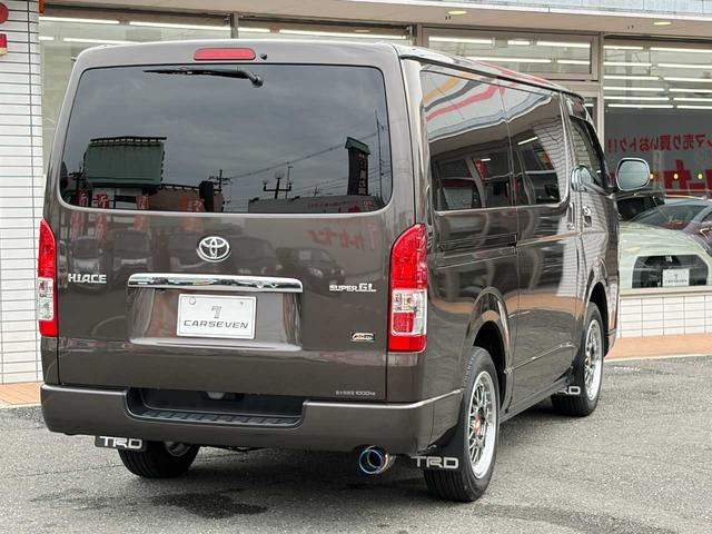 ハイエースバン スーパーGL 50TH アニバーサリーリミテッド 両側パワスラ 寒冷地仕様 TRDフロントスポイラー アルパインフローティングナビ、11.1型デジタルミラー、12.8インチフリップダウン 運転席レカロシート ユーアイビークルベッドキット(8枚目)