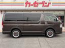 ハイエースバン スーパーGL 50TH アニバーサリーリミテッド 両側パワスラ 寒冷地仕様 TRDフロントスポイラー アルパインフローティングナビ、11.1型デジタルミラー、12.8インチフリップダウン 運転席レカロシート ユーアイビークルベッドキット(6枚目)