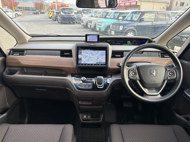 フリードハイブリッド ハイブリッド・Gホンダセンシング 衝突軽減B 純正9インチナビ Bluetooth対応 Bカメラ ビルドインETC 両側自動ドア アダプティブクルーズコントロール LEDヘッドライト スマートキー プッシュスタート 電動格納ミラー(5枚目)