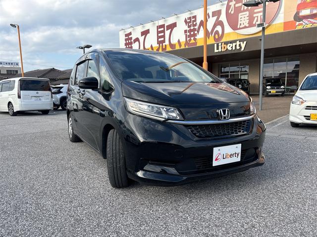 フリードハイブリッド ハイブリッド・Gホンダセンシング 衝突軽減B 純正9インチナビ Bluetooth対応 Bカメラ ビルドインETC 両側自動ドア アダプティブクルーズコントロール LEDヘッドライト スマートキー プッシュスタート 電動格納ミラー(16枚目)