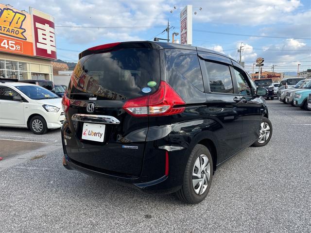 フリードハイブリッド ハイブリッド・Gホンダセンシング 衝突軽減B 純正9インチナビ Bluetooth対応 Bカメラ ビルドインETC 両側自動ドア アダプティブクルーズコントロール LEDヘッドライト スマートキー プッシュスタート 電動格納ミラー(19枚目)