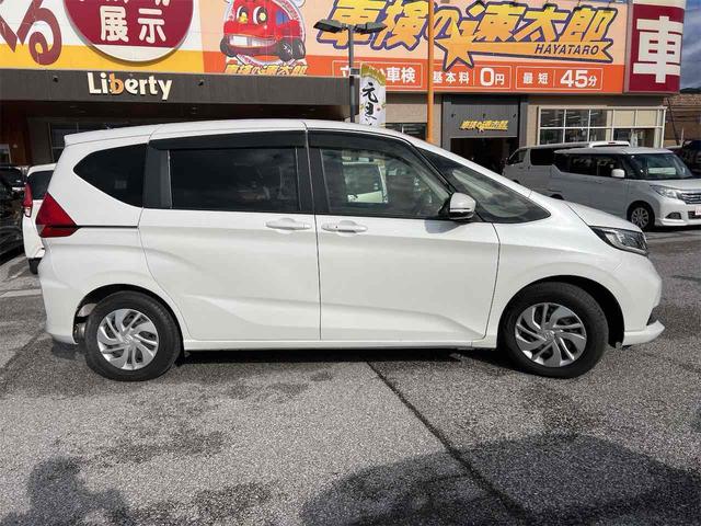 フリード Ｇ・ホンダセンシング　バックカメラ　クリアランスソナー　オートクルーズコントロール　レーンアシスト　衝突被害軽減システム　両側電動スライドドア　オートライト　スマートキー　アイドリングストップ　電動格納ミラー　３列シート（10枚目）