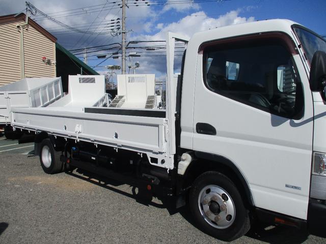 キャンター 2トン ワイド超ロング 全低床 5速MT 鳥居鉄板 荷台塗装 荷寸500-191-38 床板後ろ鉄板 ETC ロープ穴左右3ヶ所ずつ リアアオリ内側鉄板 左電格ミラー 150馬力 ABS ロープフック ターボ 取扱説明書 WL Wロング 2トン車 架装(9枚目)