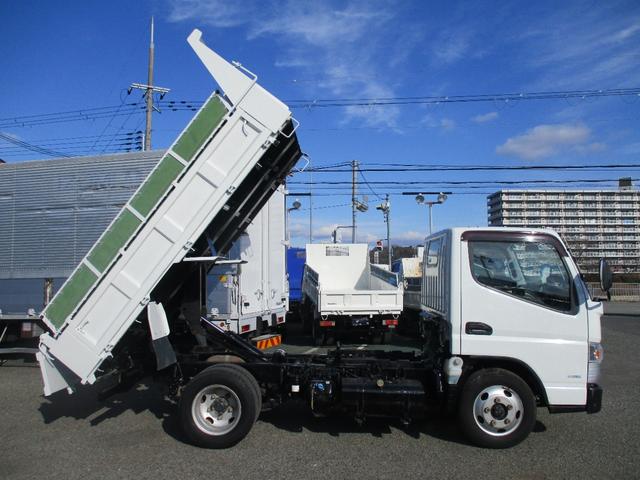 キャンター ３トン　強化ダンプ　全低床　５速ＭＴ　コボレーン　あゆみ掛け　荷寸３０４－１５９－３７　４ナンバー　１５０馬力　極東製　左電格ミラー　枕木　ＡＢＳ　車線逸脱警報装置　２トン車　オーバーヘッドコンソール　地上高８６ｃｍ　コボレーンシート　盗難防止システム　小型（8枚目）