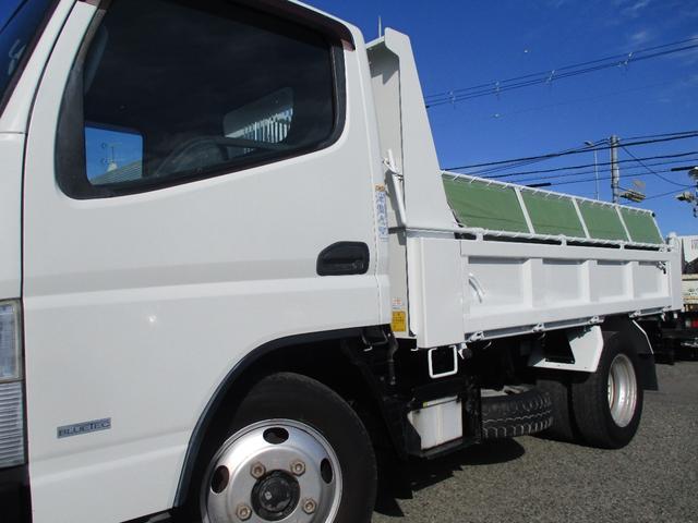 キャンター ３トン　強化ダンプ　全低床　５速ＭＴ　コボレーン　あゆみ掛け　荷寸３０４－１５９－３７　４ナンバー　１５０馬力　極東製　左電格ミラー　枕木　ＡＢＳ　車線逸脱警報装置　２トン車　オーバーヘッドコンソール　地上高８６ｃｍ　コボレーンシート　盗難防止システム　小型（10枚目）