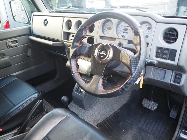 ジムニー ワイルドウインド　リフトアップ　ミッキートンプソン１５ＡＷ　オーバーフェンダー　Ｆ／Ｒパイプバンパー　ディスプレイオーディオ　ＤＶＤ／ＣＤ／ＢＴ　社外ステアリング／グリル　シートカバー　ＬＥＤライト（21枚目）