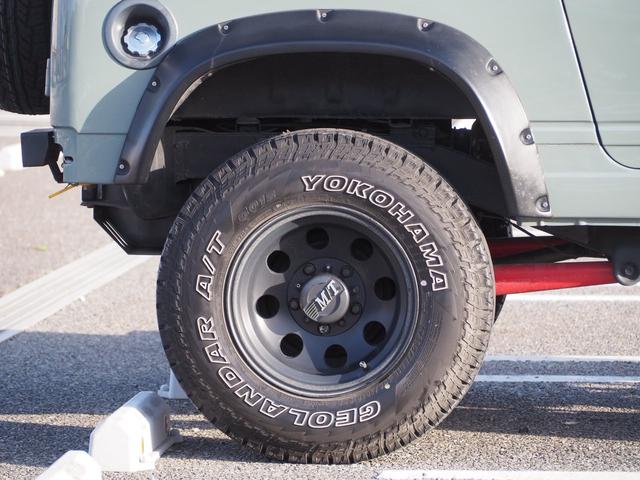 ジムニー ワイルドウインド　ユーザー様買取車　リフトアップ　オーバーフェンダー　１５ＡＷ　ジオランダーＡＴタイヤ　Ｆ／Ｒパイプバンパー　社外マフラー／グリル　ＬＥＤライト／テール　ＣＤ　Ｂｌｕｅｔｏｏｔｈ　ｉＰｏｄ　シートカバー（11枚目）