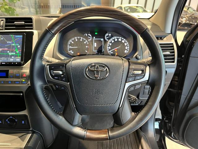 ランドクルーザープラド TX Lパッケージ ムーンルーフ/ブラックルーフレール/19インチ純正アルミホイール/モデリスタ フロントスポイラー/モデリスタ リアスカート/モデリスタリアスポイラー/純正OPウッド調ステアリング/アルパインナビ(14枚目)