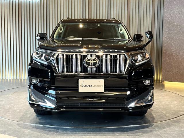 ランドクルーザープラド TX Lパッケージ ムーンルーフ/ブラックルーフレール/19インチ純正アルミホイール/モデリスタ フロントスポイラー/モデリスタ リアスカート/モデリスタリアスポイラー/純正OPウッド調ステアリング/アルパインナビ(24枚目)