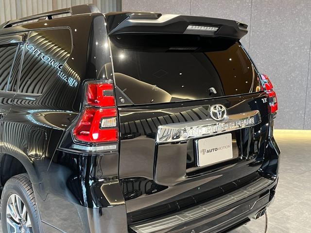 ランドクルーザープラド TX Lパッケージ ムーンルーフ/ブラックルーフレール/19インチ純正アルミホイール/モデリスタ フロントスポイラー/モデリスタ リアスカート/モデリスタリアスポイラー/純正OPウッド調ステアリング/アルパインナビ(37枚目)