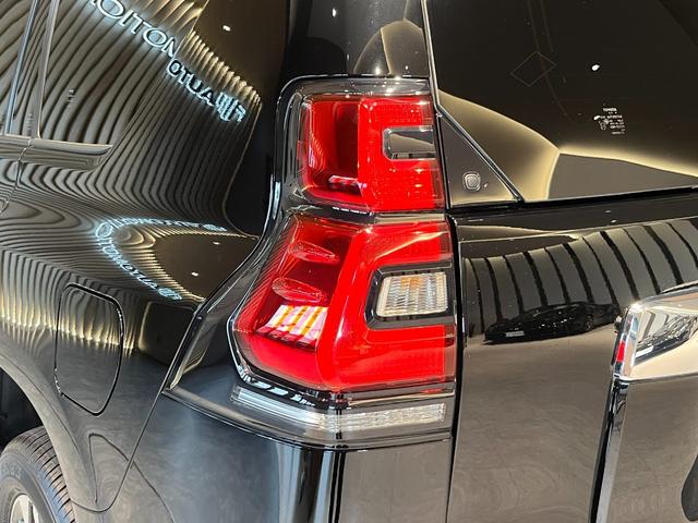 ランドクルーザープラド TX Lパッケージ ムーンルーフ/ブラックルーフレール/19インチ純正アルミホイール/モデリスタ フロントスポイラー/モデリスタ リアスカート/モデリスタリアスポイラー/純正OPウッド調ステアリング/アルパインナビ(38枚目)