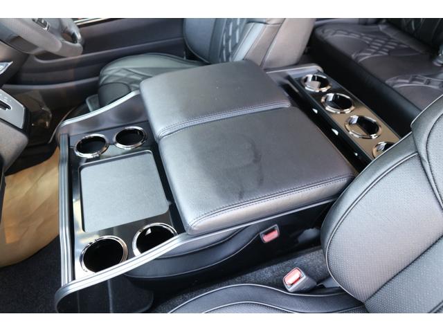 ハイエースコミューター スーパーロングＧＬ　３ナンバー乗用車登録１０人３列目対面ラウンジベッド家具テーブルフローリング天井ダウンライトバケットシートカバーセンターコンソールアルパインＢＩＧＸ１１ナビ後席１２．８ｉｎモニター２ピース１８ｉｎアルミ（53枚目）