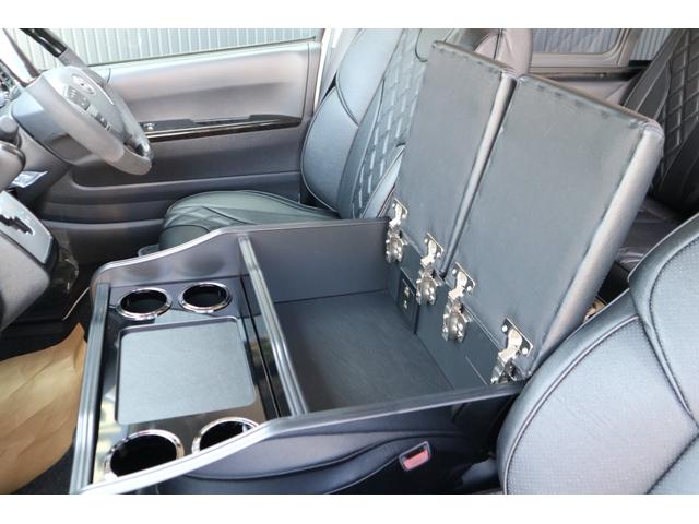 ハイエースコミューター スーパーロングＧＬ　３ナンバー乗用車登録１０人３列目対面ラウンジベッド家具テーブルフローリング天井ダウンライトバケットシートカバーセンターコンソールアルパインＢＩＧＸ１１ナビ後席１２．８ｉｎモニター２ピース１８ｉｎアルミ（55枚目）