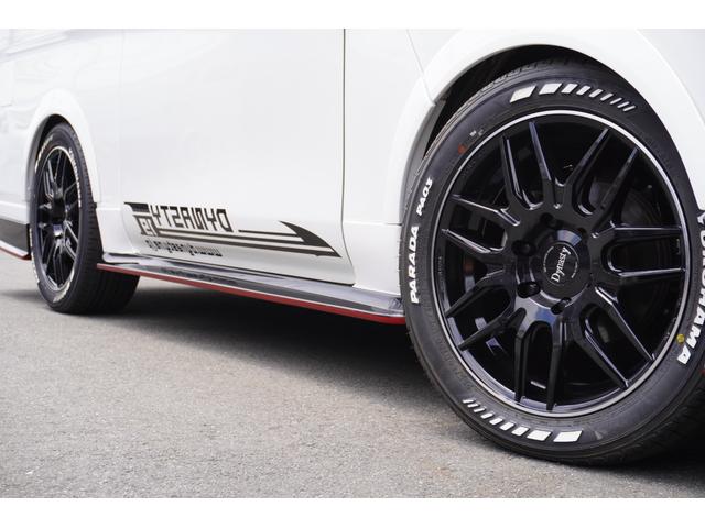 キャラバン ロンググランドプレミアムＧＸ　ＤｙｎａｓｔｙＡＬＡＩＶＥ・ＧＴ－ｖフルエアロカスタムコンプリートオーバーフェンダー１８ｉｎアルミバケットシートカバーベットキット９ｉｎナビ後席モニターセンターコンソールレッドインテリア電動スライド（17枚目）