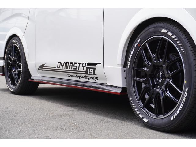 キャラバン ロンググランドプレミアムＧＸ　ＤｙｎａｓｔｙＡＬＡＩＶＥ・ＧＴ－ｖフルエアロカスタムコンプリートオーバーフェンダー１８ｉｎアルミバケットシートカバーベットキット９ｉｎナビ後席モニターセンターコンソールレッドインテリア電動スライド（33枚目）