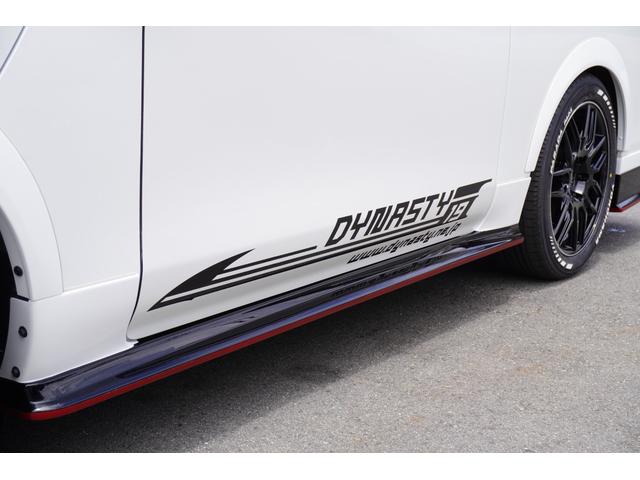 キャラバン ロンググランドプレミアムＧＸ　ＤｙｎａｓｔｙＡＬＡＩＶＥ・ＧＴ－ｖフルエアロカスタムコンプリートオーバーフェンダー１８ｉｎアルミバケットシートカバーベットキット９ｉｎナビ後席モニターセンターコンソールレッドインテリア電動スライド（34枚目）