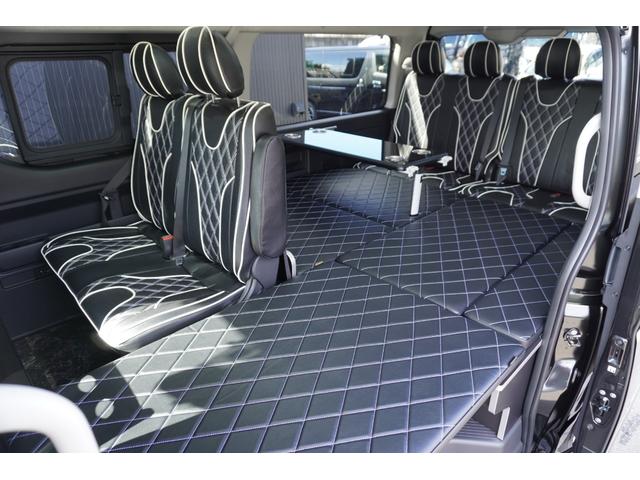 ハイエースワゴン ＧＬ　登録済未使用車３列目対面ラウンジベッド家具オプションベッドフローリングテーブルカスタムコンプリートＩＦ－ＷＢ８フルフラット対面ラウンジアルパインＢＩＧＸ１１ナビ後席１２．８モニターセンターコンソール（24枚目）