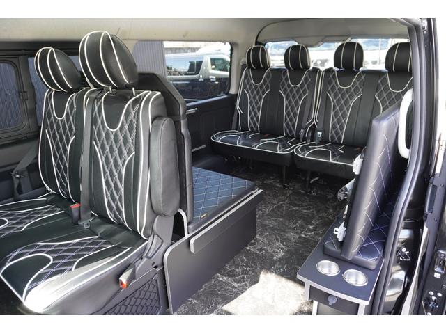 ハイエースワゴン ＧＬ　登録済未使用車３列目対面ラウンジベッド家具オプションベッドフローリングテーブルカスタムコンプリートＩＦ－ＷＢ８フルフラット対面ラウンジアルパインＢＩＧＸ１１ナビ後席１２．８モニターセンターコンソール（30枚目）