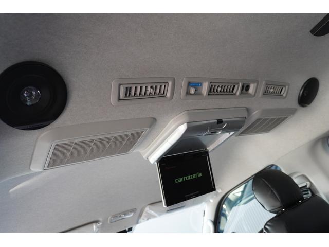 ハイエースワゴン ＧＬ　登録済み未使用車２列目３名Ｉ－ｓｅａｔＲＥＶＯシート対面ラウンジベッド家具ＩＦ－ＷＲ９フローリングテーブル天井間接照明フルフラットベッド対面ラウンジ地ナビ後席モニター天井スピーカーセンターコンソール（50枚目）