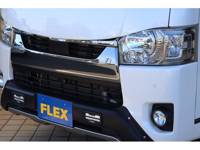 ハイエースバン スーパーGL ダークプライムII バッドフェイスボンネット TRDデイライト付きフロントスポイラー TRDマッドフラップ FLEXオーバーフェンダー RAYS 16インチAW TOYOオープンカントリー アルパインBIGXナビ(24枚目)