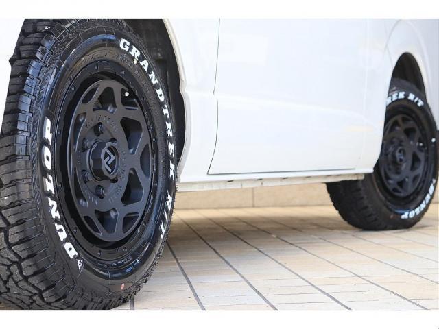 ハイエースバン スーパーGL ダークプライム Re classic社外製ボンネットDUNLOP GRANDTEK16インチタイヤNEXUSTRAIL16インチAWFLEXクラシックシートカバーベッドキット木目調カーゴパネルパナソニック7インチナビ(12枚目)