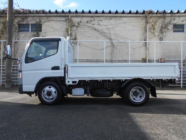 ＮＴ４５０アトラス フルスーパーロー平ボディ　カスタム　２０００ｋｇ積み４ナンバー　リアＷタイヤ　社外ナビＴＶ　ＥＴＣ　キーレス　スペアキー　両側電動格納ミラー　衝突被害軽減ブレーキ　車線逸脱警報装置　横滑り防止装置　荷台床鉄板張り　坂道発進補助装置（4枚目）