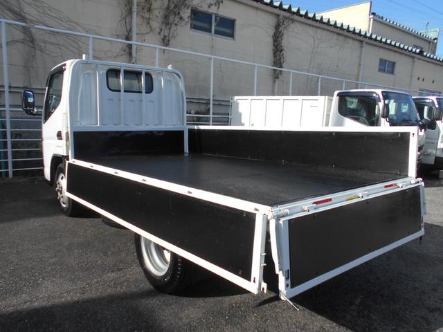 ＮＴ４５０アトラス フルスーパーロー平ボディ　カスタム　２０００ｋｇ積み４ナンバー　リアＷタイヤ　社外ナビＴＶ　ＥＴＣ　キーレス　スペアキー　両側電動格納ミラー　衝突被害軽減ブレーキ　車線逸脱警報装置　横滑り防止装置　荷台床鉄板張り　坂道発進補助装置（10枚目）