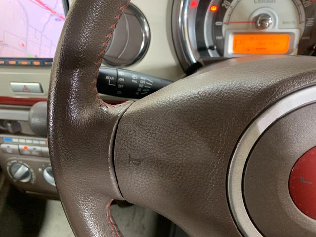 アルトラパンショコラ Ｇ　純正ＳＤナビ　ワンセグ　電格ドアミラー　プッシュスタートエンジン　オートライト　ＨＩＤヘッドライト　オリジナルシートカバー　純正１４インチアルミホイール　チルトステアリング　盗難防止システム（17枚目）