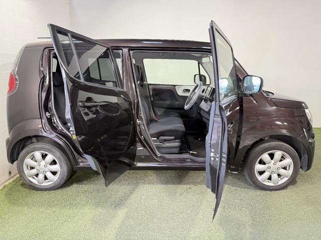 ＭＲワゴン １０ｔｈアニバーサリー　リミテッド　保証付き　修復歴無　Ｂカメラ　ＨＩＤオートライト　Ｐスタート　タッチパネルオーディオ　ＵＳＢ　ＣＤ　ステアリングスイッチ　スマートキー　純正１４インチＡＷ　ウィンカーミラー　ベンチシート　フルフラット（26枚目）