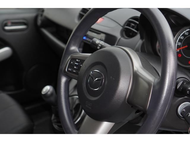 デミオ １３Ｃ　５速ＭＴ／ワンオーナー／バリューパッケージ／ダークテインテッドガラス／キーレスキー／電動格納ミラー／ＣＤオーディオ（ＵＳＢ端子付き）（23枚目）