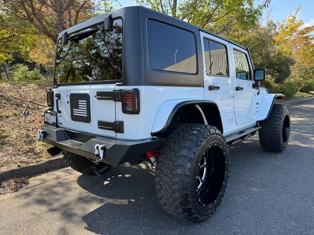 ジープ・ラングラーアンリミテッド スポーツ D車/リフトUP/22インチAW/前後スチールバンパー/スクリーンガード/オーバーフェンダー/スチールサイドステップ/2本出しマフラー/LEDヘッド・テール/社外フード/パナナビ/リクライニングKIT(12枚目)