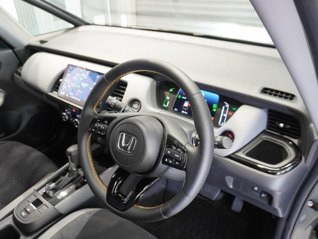 フィット e:HEVRS ワンオーナー 9型ナビ ナビ連動前後ドラレコ 衝突軽減ブレーキ 急アクセル抑制機能 サイド&カーテンAB LEDオートライト オートハイビーム パーキングセンサー ブレーキホールド Rカメラ ETC(33枚目)