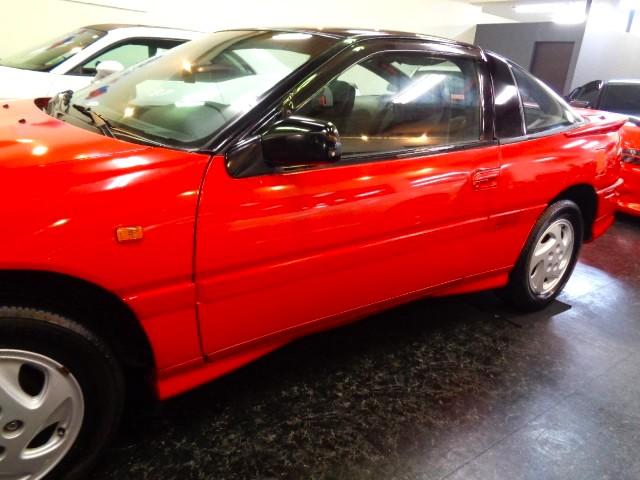 エクリプス ＧＳＲ－４　４Ｇ６３ターボエンジン純正５ＭＴミッション４ＷＤ専用２本出しマフラーパッションレッドカラー専用フルエアロ純正アルミマイルコンビメーターリトラクタブルヘッドライト走行３万ｋｍ台フルノーマル車ジャッキーＣ（18枚目）