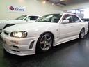 スカイライン GT R34GTRVスペックNISMO仕様フルエアロ4DセダンRB20DENEO6エンジン純正5MTミッション2本出しマフラー車高調追加メーターENKEI製RP03アルミクリアヘッドライトTベルト交換済(7枚目)