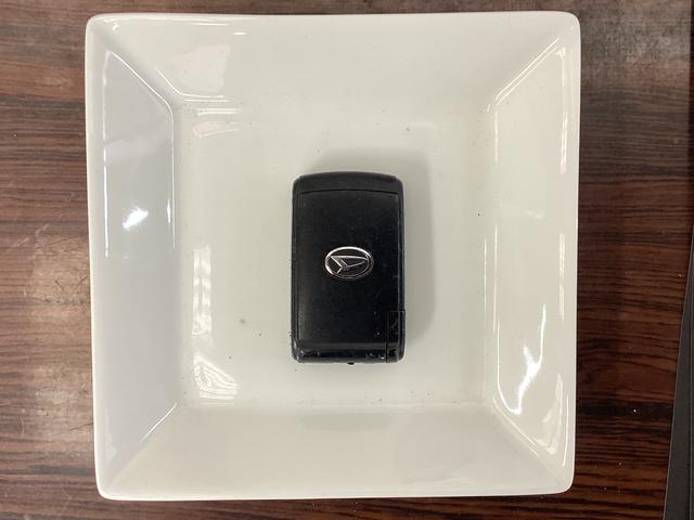 ムーヴ Ｘリミテッド　ワンオーナー　バックカメラ　ナビ　ワンセグ　ワンオーナー　バックカメラ　ナビ　ワンセグＴＶ　アクセサリーソケット　電動格納ミラー　スマートキー　オートエアコン　ＡＢＳ　アイドリングストップ　ヘッドライトレべライザー　１４インチ純正アルミホイール（15枚目）