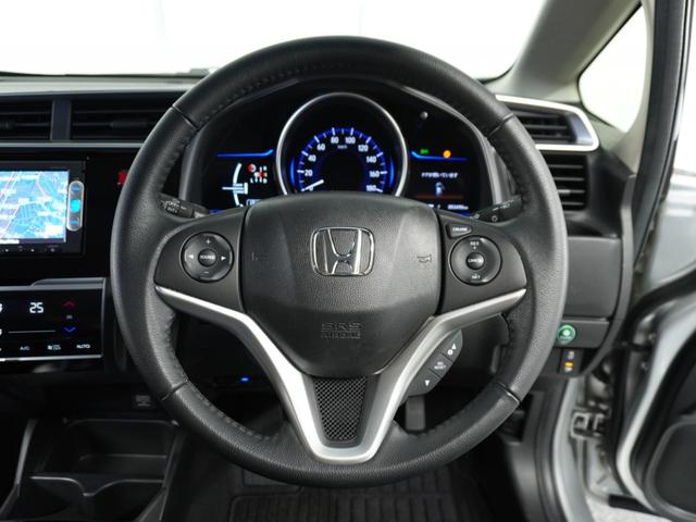 フィットハイブリッド Lパッケージ 衝突被害軽減システム/純正ナビゲーション/バックカメラ/音楽CD再生/オートエアコン/LEDヘッドライト/クルーズコントロール/ETC/スマートキー/盗難防止装置/横滑り制御装置/オートライト/ETC(7枚目)