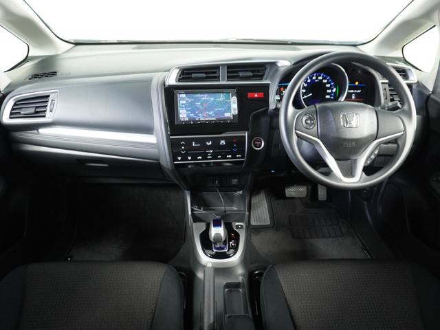 フィットハイブリッド Fパッケージ 1オ-ナ-ナビRカメETCワンセグBT接続DVD 盗難警報装置 ワンオ-ナ-車 AUTOエアコン 助手席エアバック ECON ETC付き リヤカメラ USB ABS付 DVD視聴 横滑り防止システム(8枚目)