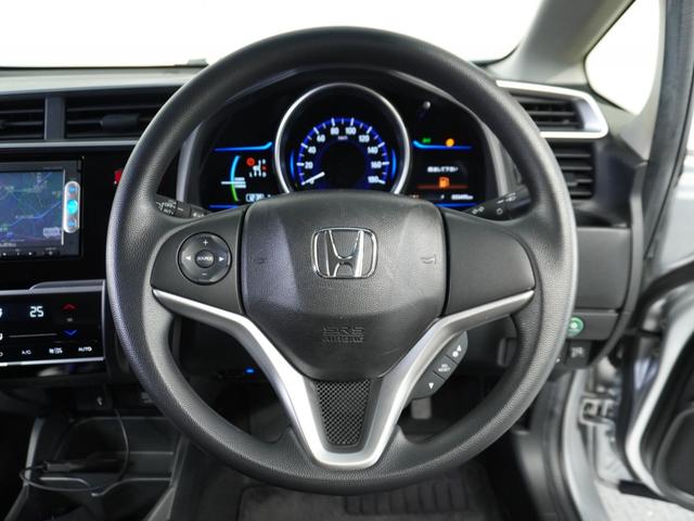 フィットハイブリッド Fパッケージ 1オ-ナ-ナビRカメETCワンセグBT接続DVD 盗難警報装置 ワンオ-ナ-車 AUTOエアコン 助手席エアバック ECON ETC付き リヤカメラ USB ABS付 DVD視聴 横滑り防止システム(9枚目)