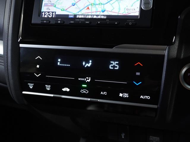 フィットハイブリッド Fパッケージ 1オ-ナ-ナビRカメETCワンセグBT接続DVD 盗難警報装置 ワンオ-ナ-車 AUTOエアコン 助手席エアバック ECON ETC付き リヤカメラ USB ABS付 DVD視聴 横滑り防止システム(10枚目)