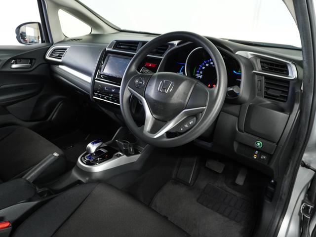 フィットハイブリッド Fパッケージ 1オ-ナ-ナビRカメETCワンセグBT接続DVD 盗難警報装置 ワンオ-ナ-車 AUTOエアコン 助手席エアバック ECON ETC付き リヤカメラ USB ABS付 DVD視聴 横滑り防止システム(57枚目)