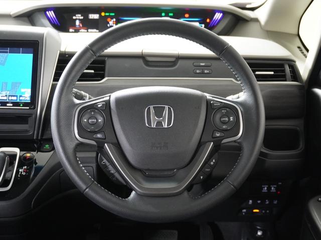 フリードハイブリッド ハイブリッド・Ｇホンダセンシング　１オ－ナ－ナビＤレコＲカメＥＴＣ両電扉ＢＴ地デジ　アダプティブクルーズコントロール　Ｂｌｕｅｔｏｏｔｈ　シートヒーター　１５インチ純正アルミホイール　フルセグＴＶ　ＤＶＤ　ＵＳＢ　スペアキー有　禁煙車（10枚目）