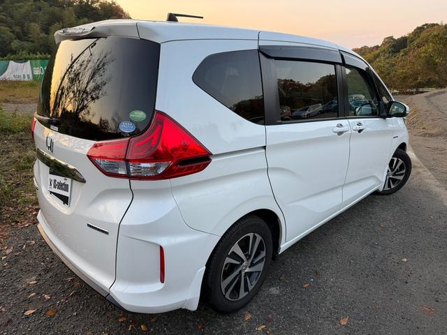 フリード＋ハイブリッド 　ハイブリッドＧホンダセンシングＣパッケージ　スマートキー　ＥＴＣ　ドライブレコーダー　両側電動スライドドア　横滑り防止　衝突被害軽減ブレーキ　バックモニター　サンシェード（3枚目）