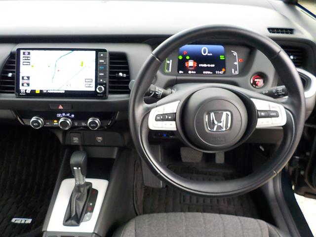 フィット ｅ：ＨＥＶホーム　ワンオーナー・Ｂｌｕｅｔｏｏｔｈ・バックカメラ・ナビ連動前後ドライブレコーダー・ＥＴＣ車載器・障害物センサー・ＣＤ＆ＤＶＤ再生可・ＬＥＤヘッドライト・衝突被害軽減ブレーキ・ハーフレザーシート（14枚目）