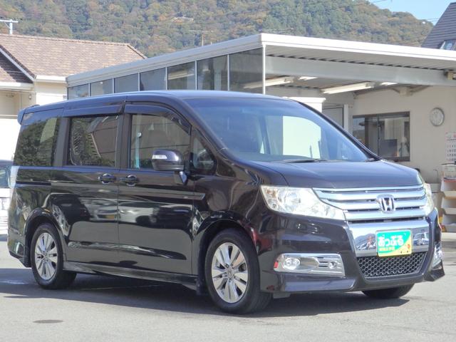 ステップワゴンスパーダ Ｚ　買取車両　純正ＨＤＤナビ　ＤＶＤ　ＣＤ　ＲＥＣ　ワンセグ　ＥＴＣ　Ｂカメラ　アルパイン製フリップダウンモニター　両側パワスラドア　パドルシフト　ＨＩＤライト　レザー調シートカバー　純正１６ＡＷ（7枚目）