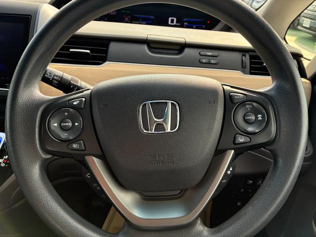 フリードハイブリッド ハイブリッド・Gホンダセンシング 純正9インチナビ CD DVD AM FM フルセグ Bluetooth バックカメラ ETC 両側電動パワースライドドア フルオートエアコン フロアマット ドアバイザー(28枚目)