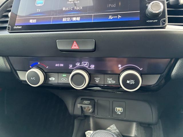 フィット ベーシック　純正ナビ　ＣＤ　ＤＶＤ　ＡＭ　ＦＭ　ＴＶフルセグ　ミュージックラック　Ｂｌｕｅｔｏｏｔｈ　バックカメラ　ブレーキホールド　フルオートエアコン　ＡＣＣ　ＥＴＣ（14枚目）