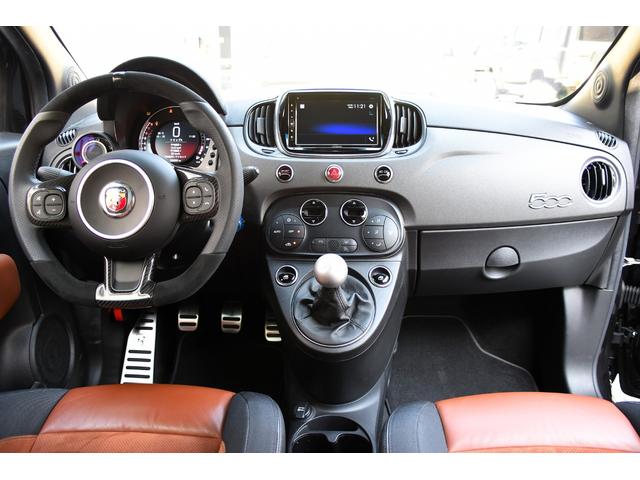 アバルト595 コンペティツィオーネ 左ハンドル 70周年記念車 左ハンドル 70th記念車 下取り車両 ワンオーナー 社外ディスプレイオーディオ コートテクトフロントガラス バックソナー レコードモンツァマフラー フロント&リアフォグランプ ブレンボ(3枚目)