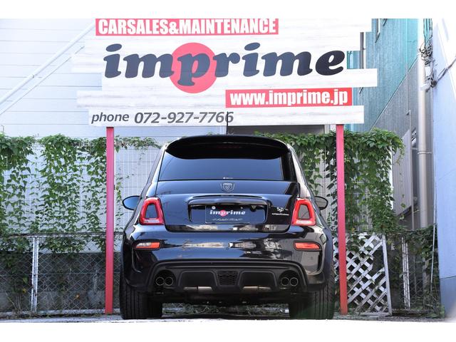 アバルト595 コンペティツィオーネ 左ハンドル 70周年記念車 左ハンドル 70th記念車 下取り車両 ワンオーナー 社外ディスプレイオーディオ コートテクトフロントガラス バックソナー レコードモンツァマフラー フロント&リアフォグランプ ブレンボ(5枚目)