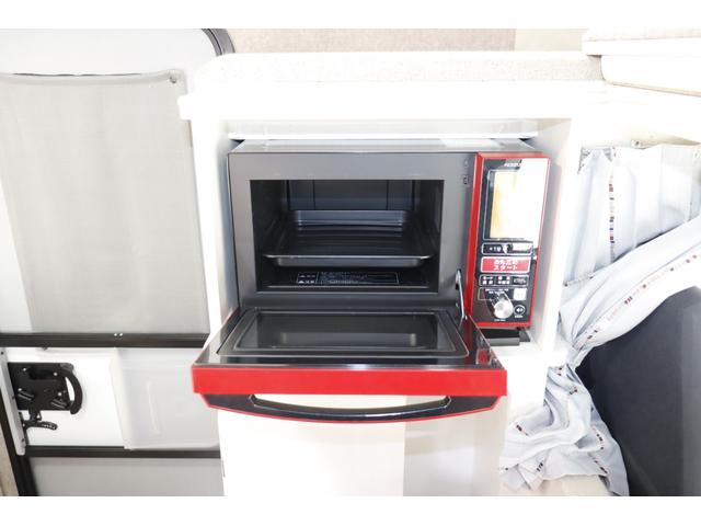 ボンゴトラック キャンパーアシスト　ジョクト　６名乗車　ＦＦヒーター　家庭用エアコン　ソーラーパネル　電子レンジ　マックスファン　１５００Ｗインバーター　ポータブル発電機　サイドオーニング　リチウム＆鉛バッテリー　キャンピングカー　キャブコン（27枚目）
