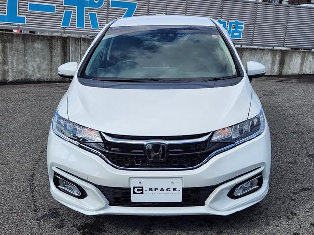フィットハイブリッド Ｌ　ホンダセンシング　１オーナー・禁煙車／純正ナビＴＶ／Ｂｌｕｅｔｏｏｔｈ／Ｂカメラ／ＥＴＣ／コンビシート／タイヤ４本新品交換渡し／スマートキー＆Ｐスタート／車両取説・ナビ取説・スペアキー有（2枚目）